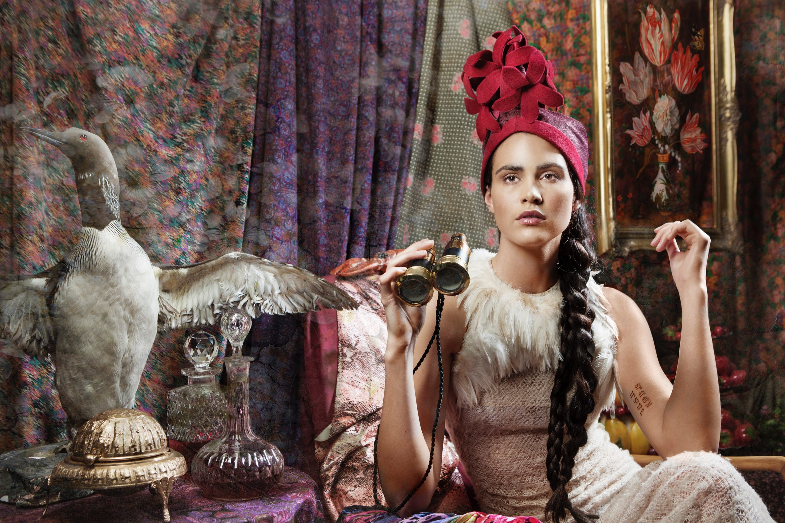 Artistic fashion portrait with taxidermy bird